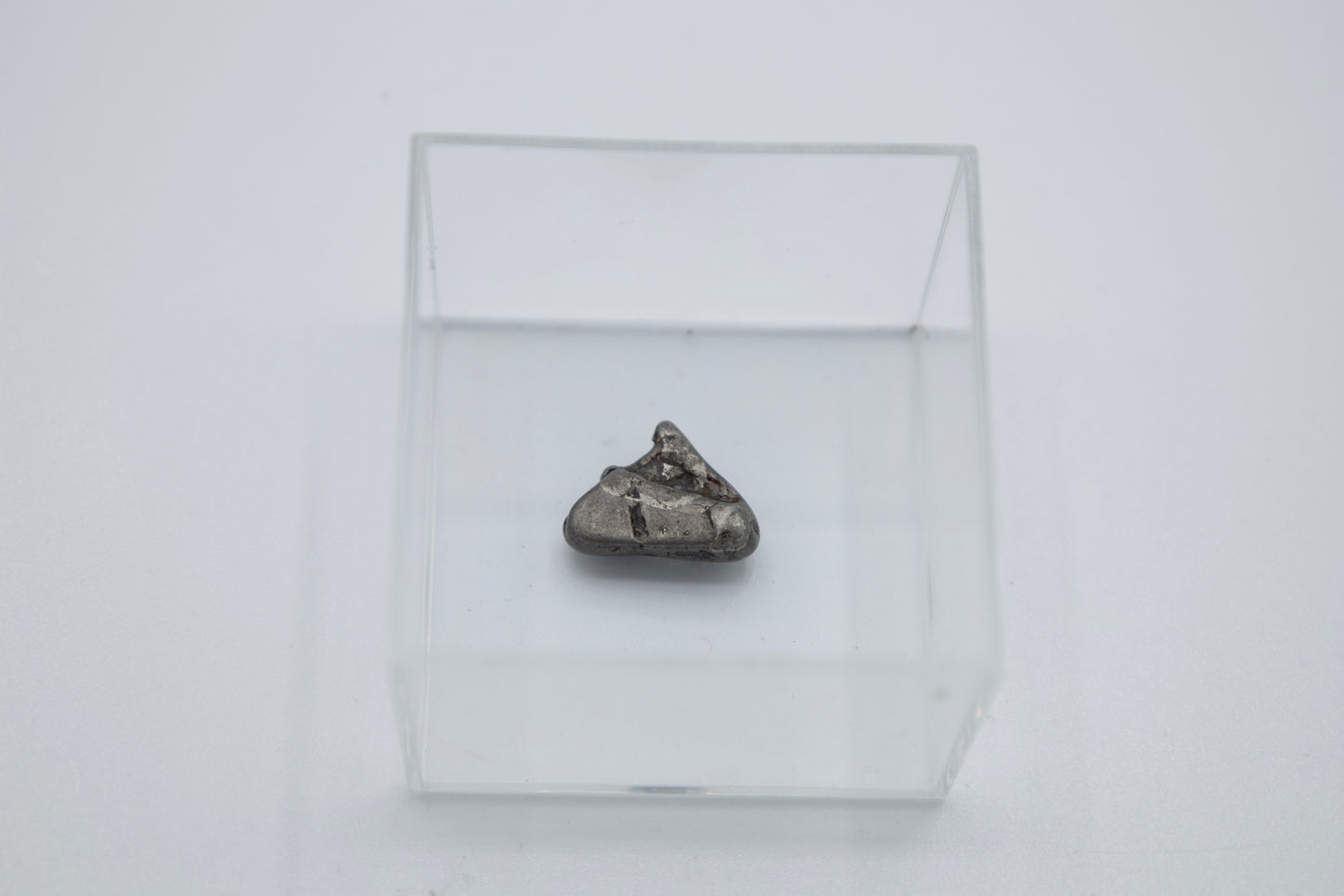 Meteorit in Lupenglas